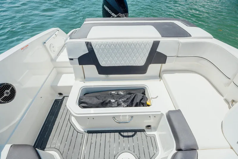 Slide: The Image of 2026 Bayliner VR6 Bowrider OB interior with storage compartment, sleek seating, and modern design. - 10