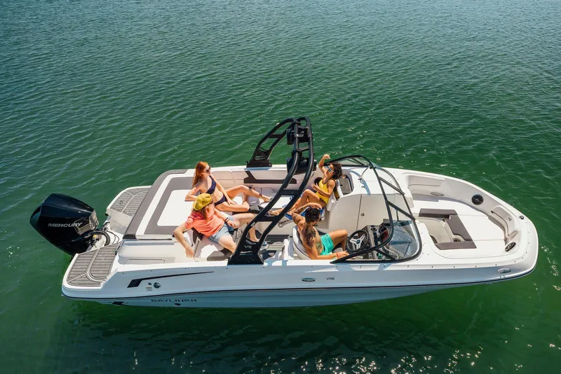 Slide: The Image of 2026 Bayliner VR6 Bowrider OB cruising on open water with passengers enjoying the ride. - 2