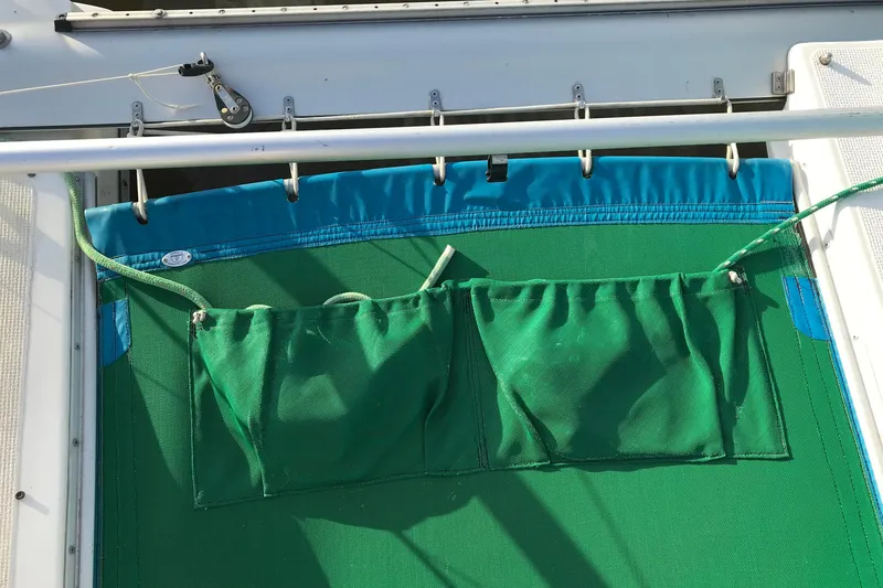 Slide: The Image of Green mesh storage pockets on a 1985 Sea Wind 24 sailboat. - 15