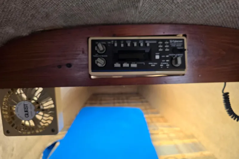 Slide: The Image of Interior of 1985 Sea Wind 24 boat showing control panel and fan. - 24