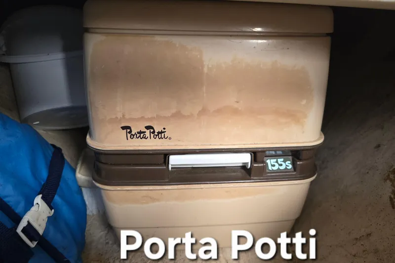 Slide: The Image of Portable toilet Porta Potti 155s inside 1985 Sea Wind 24 boat. - 25