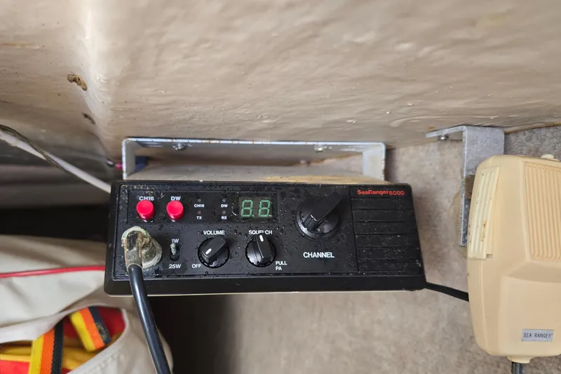 Slide: The Image of CB radio equipment on a 1985 Sea Wind 24 boat, featuring SeaRanger 6000 model. - 26