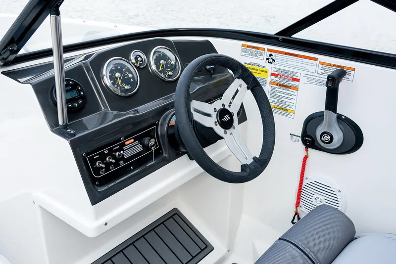 Slide: The Image of 2026 Bayliner VR4 Bowrider OB in showroom, rear view with outboard motor. - 4