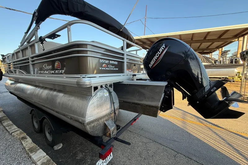 Slide: The Image of 2020 Sun Tracker Fishin' Barge 22 XP3 pontoon boat with Mercury outboard motor. - 4