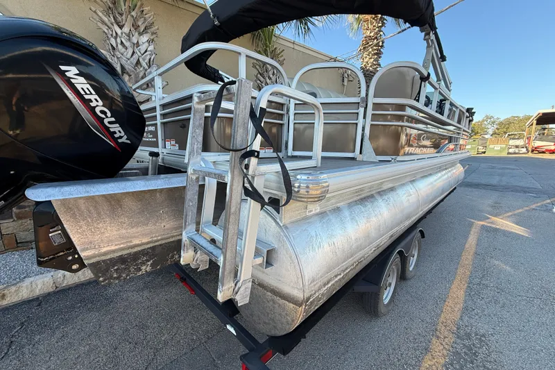 Slide: The Image of 2020 Sun Tracker Fishin' Barge 22 XP3 pontoon boat with Mercury engine, parked on trailer. - 6