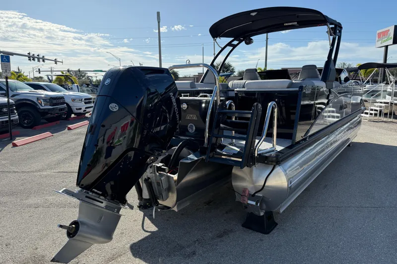 Slide: The Image of 2026 Avalon 2585 Catalina Windsheild Quad Lounger with Mercury 350hp V-10 engine, parked outdoors. - 6