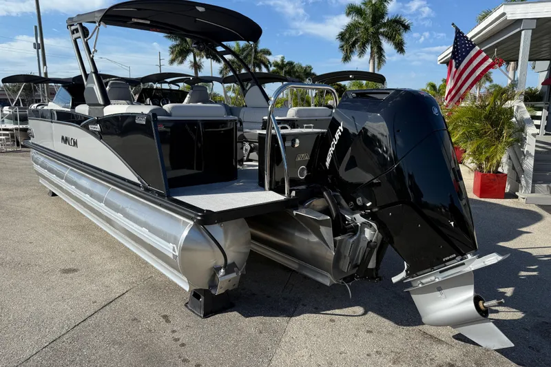 Slide: The Image of 2026 Avalon 2585 Catalina pontoon boat with Mercury 350hp V-10 engine, docked outdoors. - 7