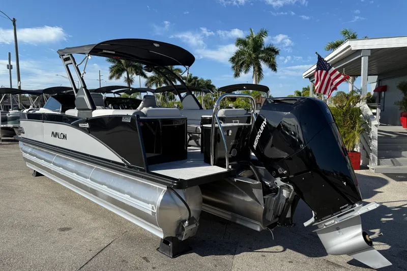 Slide: The Image of 2026 Avalon 2585 Catalina pontoon boat with Mercury 350hp V-10 engine, docked outdoors. - 8