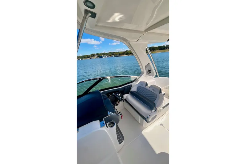 Slide: The Image of Interior view of 2019 Chaparral 347 SSX boat with seating, overlooking water. - 13
