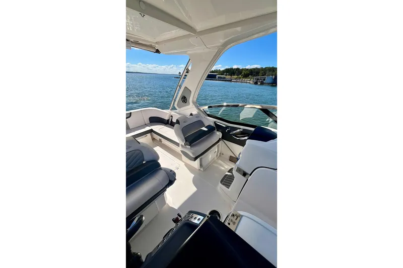 Slide: The Image of 2019 Chaparral 347 SSX boat helm with modern navigation displays and controls. - 14