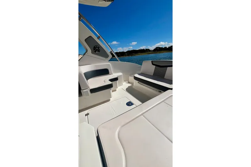 Slide: The Image of 2019 Chaparral 347 SSX boat deck with ocean view under clear blue sky. - 20