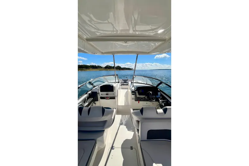Slide: The Image of 2019 Chaparral 347 SSX boat interior with clear blue sky background. - 23