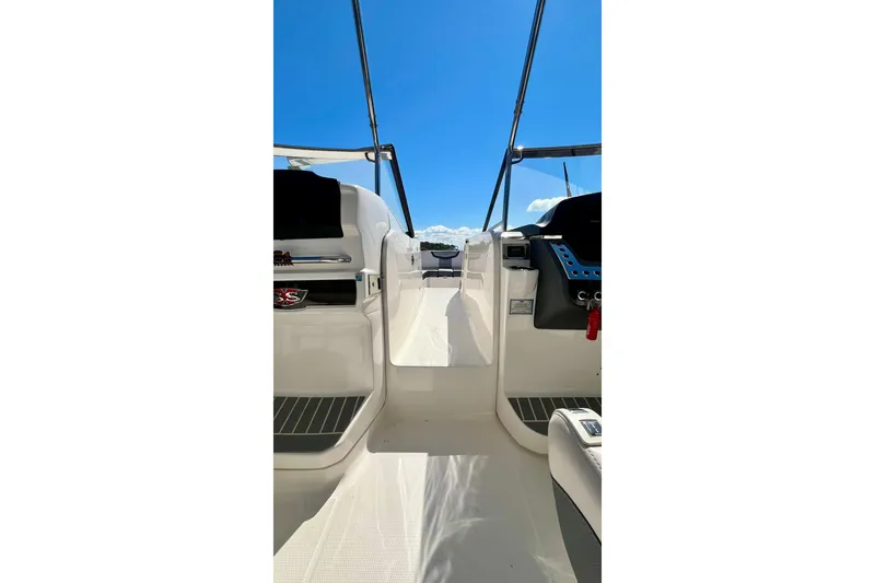 Slide: The Image of 2019 Chaparral 347 SSX boat interior with open cockpit and clear blue sky. - 24