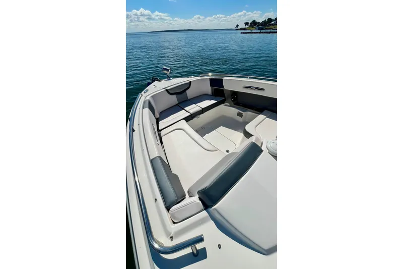 Slide: The Image of 2019 Chaparral 347 SSX boat on calm water, featuring spacious seating and scenic view. - 29