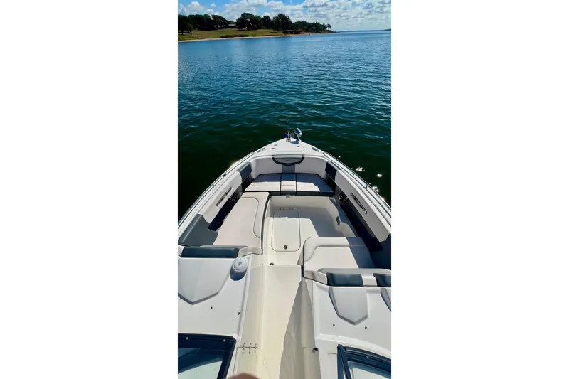 Slide: The Image of 2019 Chaparral 347 SSX boat stern with dual propellers in water. - 30