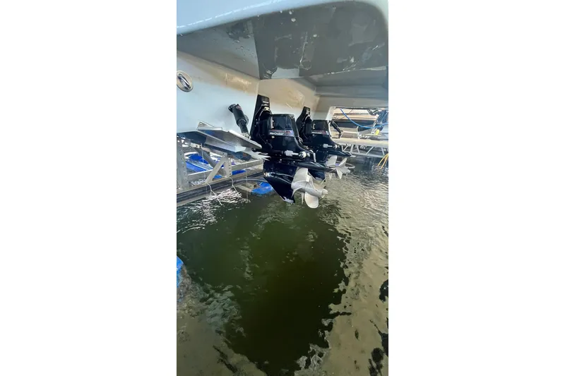 Slide: The Image of 2019 Chaparral 347 SSX boat docked under a covered marina. - 31