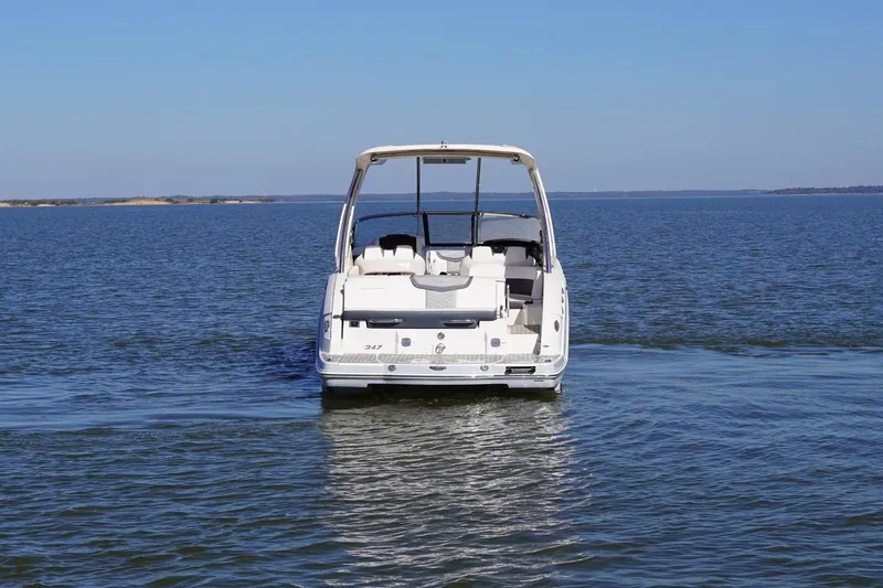 Slide: The Image of 2019 Chaparral 347 SSX boat on open water, rear view. - 5