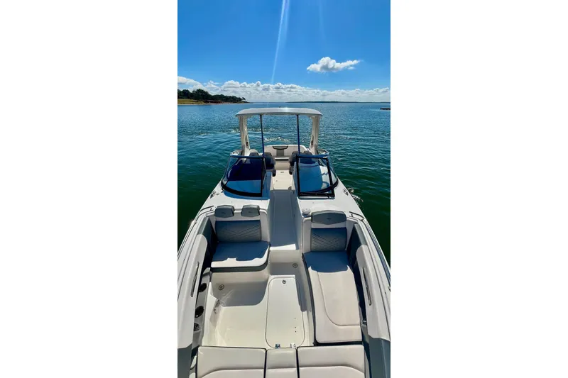 Slide: The Image of 2019 Chaparral 347 SSX boat interior with seating, on a sunny day. - 9