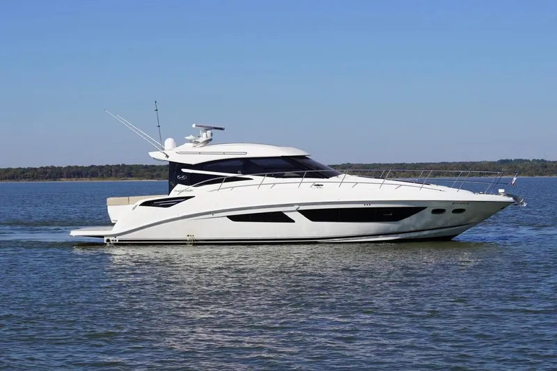 Slide: The Image of 2015 Sea Ray 470 Sundancer yacht cruising on a calm lake. - 13