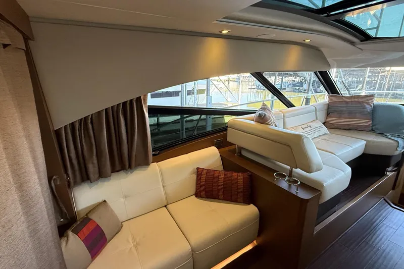 Slide: The Image of Luxurious interior of 2015 Sea Ray 470 Sundancer yacht with plush seating and elegant decor. - 24