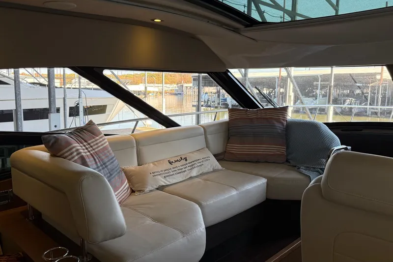 Slide: The Image of Interior of 2015 Sea Ray 470 Sundancer yacht with cozy seating and decorative pillows. - 25