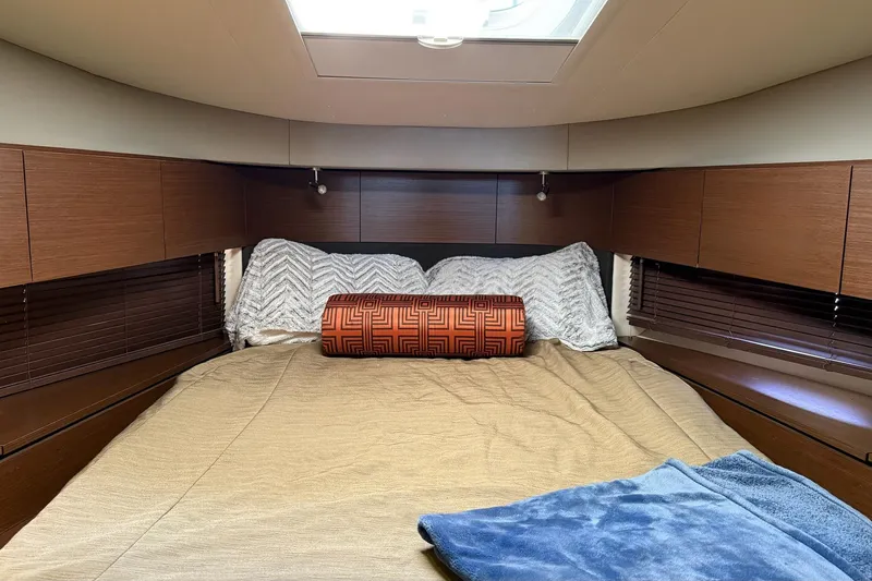 Slide: The Image of Luxurious cabin interior of 2015 Sea Ray 470 Sundancer yacht with cozy bedding. - 32