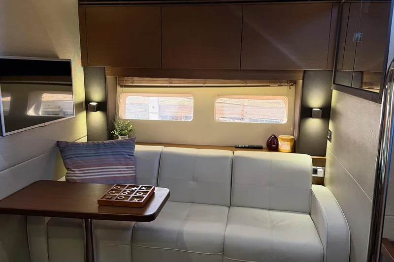 Slide: The Image of Luxurious interior of 2015 Sea Ray 470 Sundancer yacht with cozy seating and modern decor. - 35
