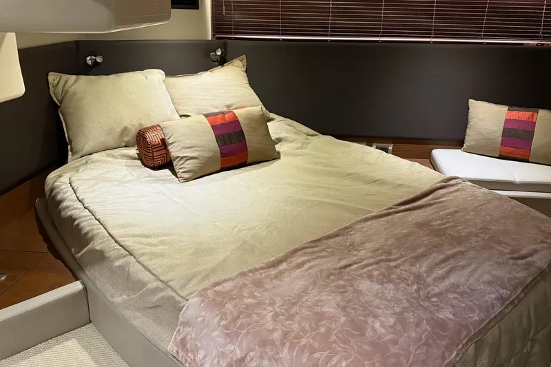 Slide: The Image of Luxurious bedroom interior of 2015 Sea Ray 470 Sundancer yacht with plush bedding. - 39
