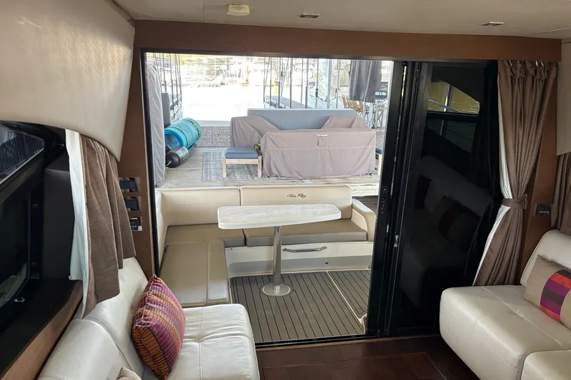 Slide: The Image of Interior of 2015 Sea Ray 470 Sundancer yacht, featuring elegant seating and modern design. - 50