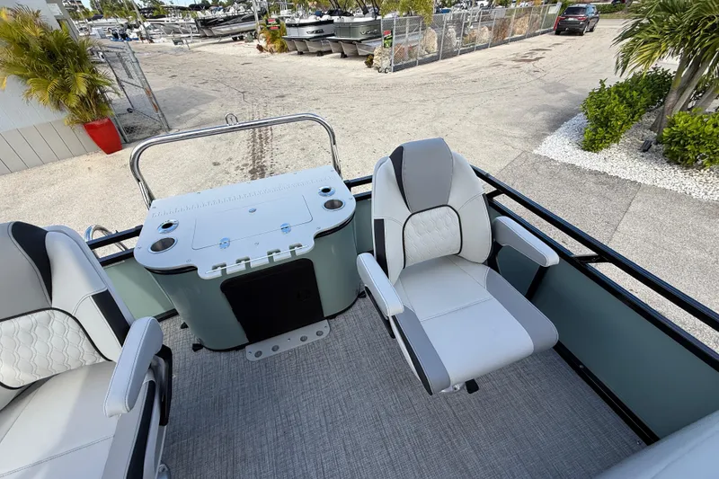 Slide: The Image of 2026 Avalon 2385 Venture boat interior with center console and comfortable seating. - 24