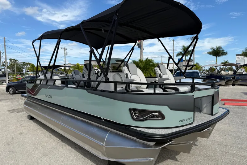 Slide: The Image of 2026 Avalon 2385 Venture pontoon boat with center console, tri-toon design, and high-performance features. - 5