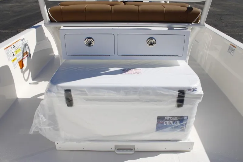 Slide: The Image of 2026 Skeeter SX230 boat interior with tan seats and powerful engine. - 11