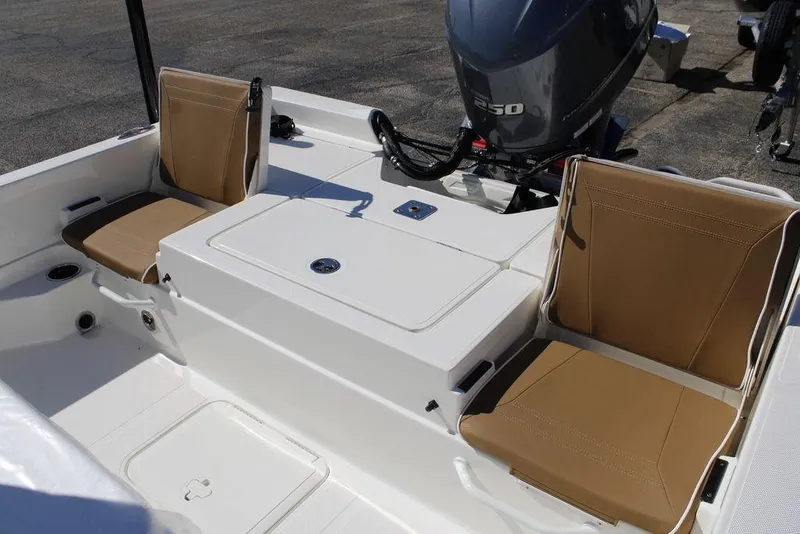 Slide: The Image of 2026 Skeeter SX230 boat seat with rod holders and storage compartments. - 12