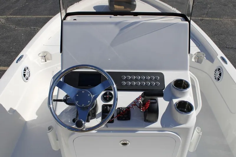 Slide: The Image of 2026 Skeeter SX230 boat interior with tan seating and modern design. - 13