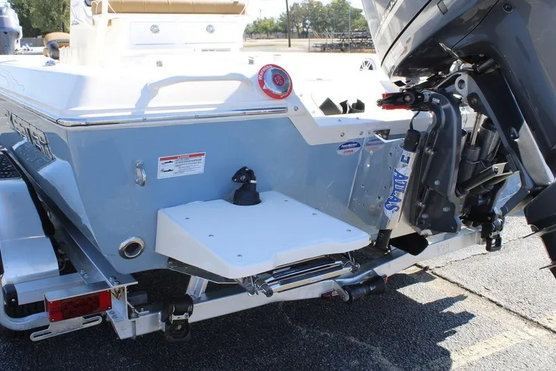 Slide: The Image of 2026 Skeeter SX230 boat interior with rod holders and seating. - 21