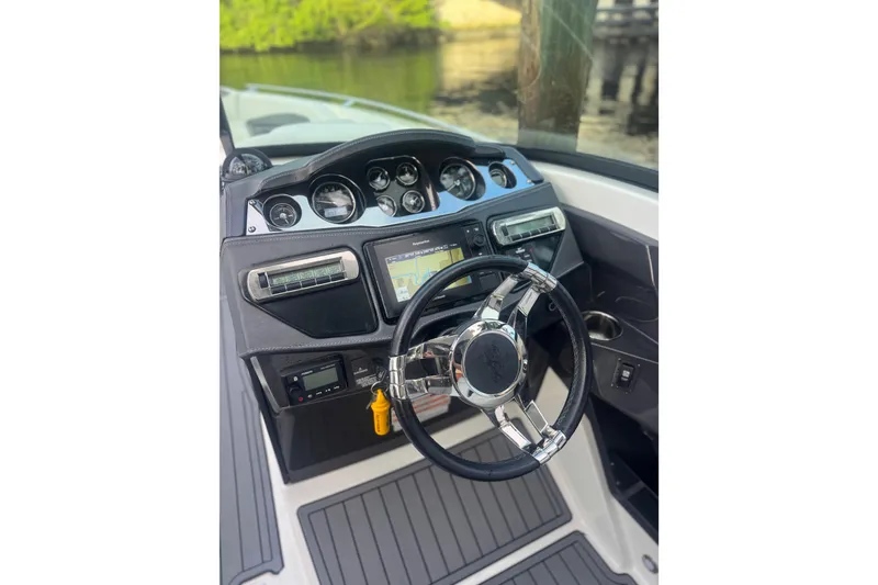 Slide: The Image of 2017 Monterey 298SS Super Sport boat dashboard with steering wheel and navigation system. - 11