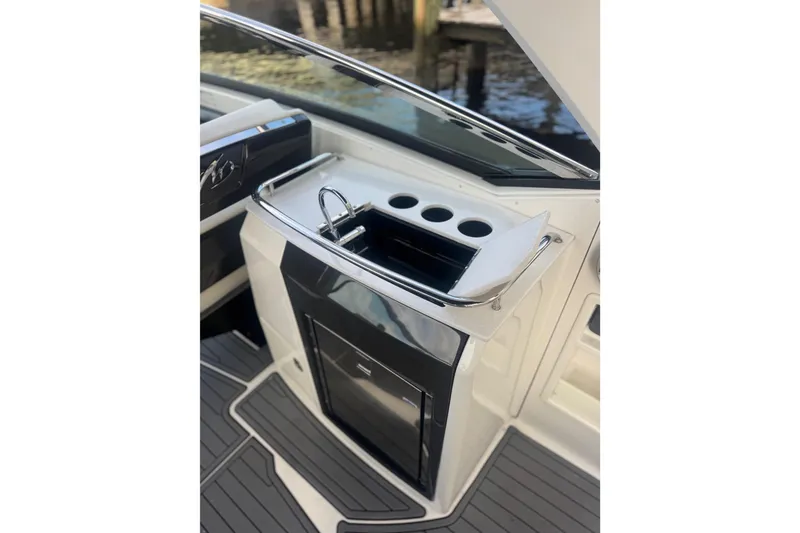 Slide: The Image of 2017 Monterey 298SS Super Sport boat interior with sleek sink and cup holders. - 15
