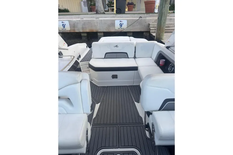 Slide: The Image of 2017 Monterey 298SS Super Sport boat interior with white seating and sleek flooring. - 16