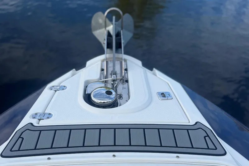Slide: The Image of 2017 Monterey 298SS Super Sport boat bow with sleek design on calm water. - 4