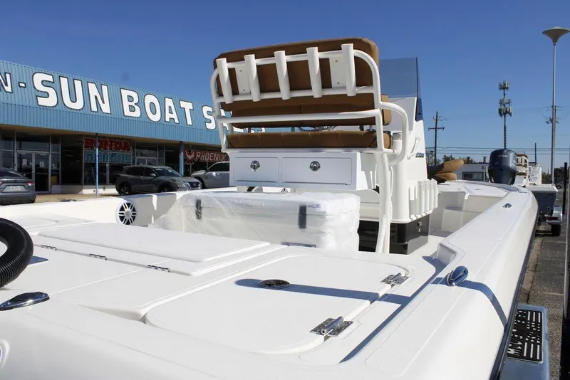 Slide: The Image of 2026 Skeeter SX241 boat displayed at Sun Boat Sales dealership. - 11