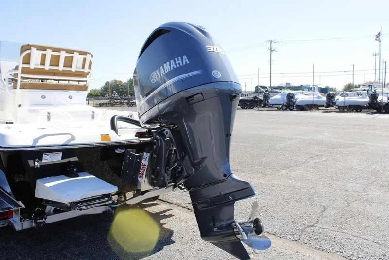 Slide: The Image of 2026 Skeeter SX241 boat with Yamaha 300 outboard motor in a parking lot. - 3