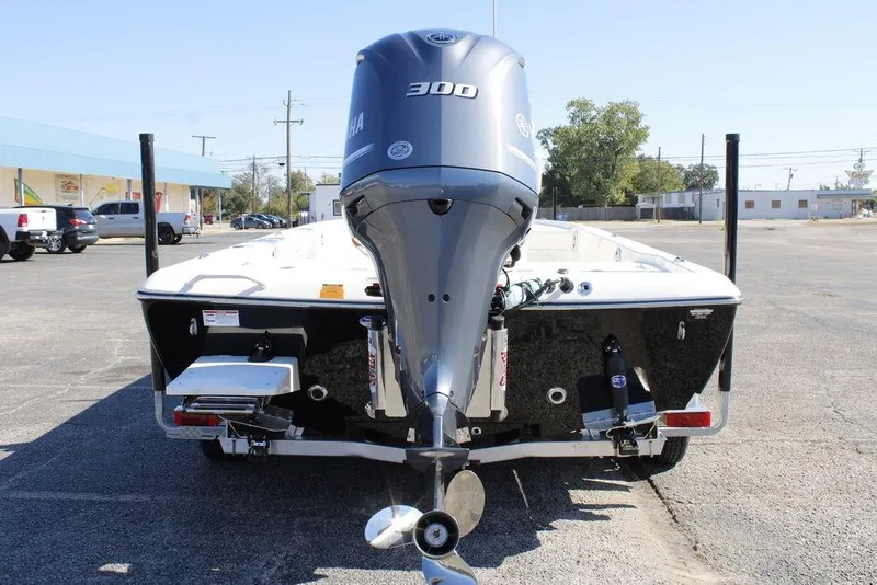 Slide: The Image of 2026 Skeeter SX241 boat with Yamaha 300 engine, parked in a lot. - 9