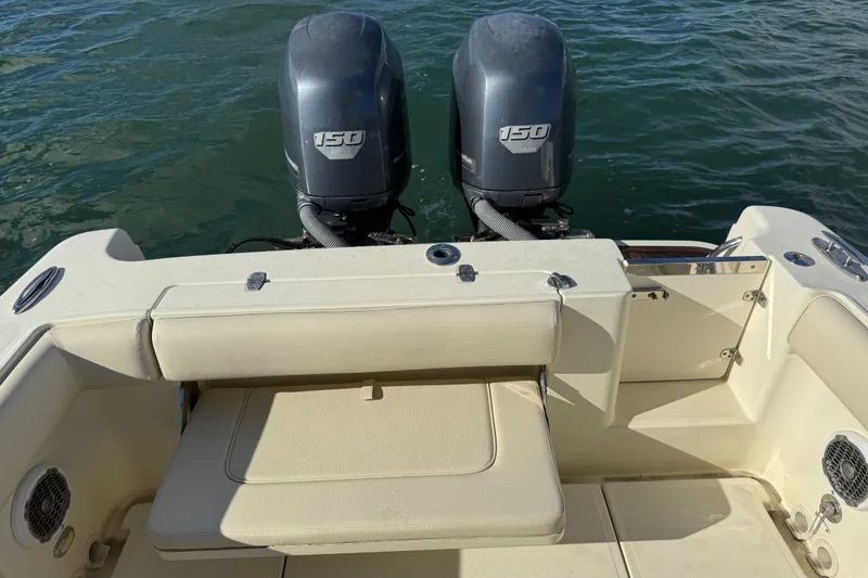 Slide: The Image of 2013 Chris-Craft Catalina 26 boat with dual 150 horsepower engines on water. - 12