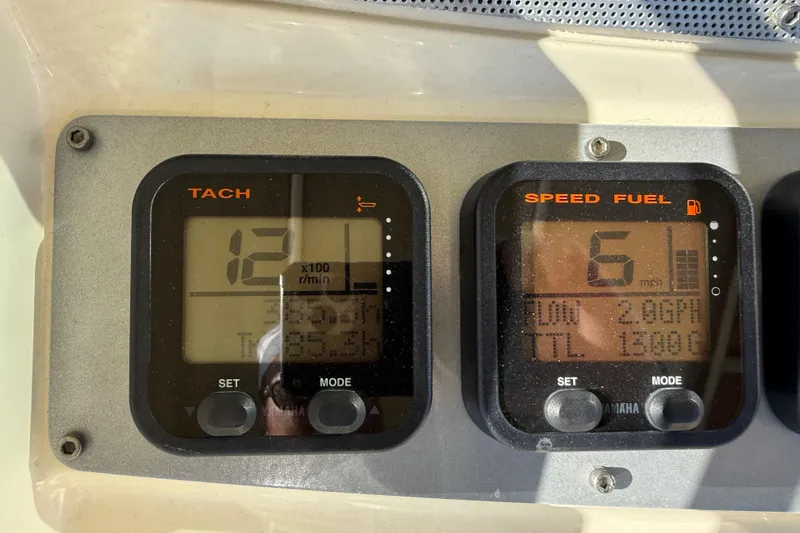 Slide: The Image of Dashboard of 2013 Chris-Craft Catalina 26 showing tachometer and speed fuel gauges. - 18