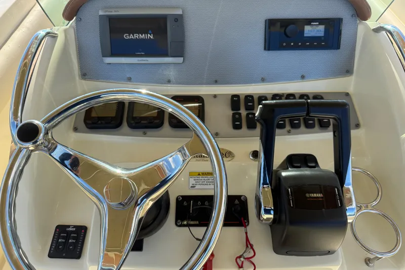 Slide: The Image of 2013 Chris-Craft Catalina 26 helm with Garmin navigation and Yamaha controls. - 19