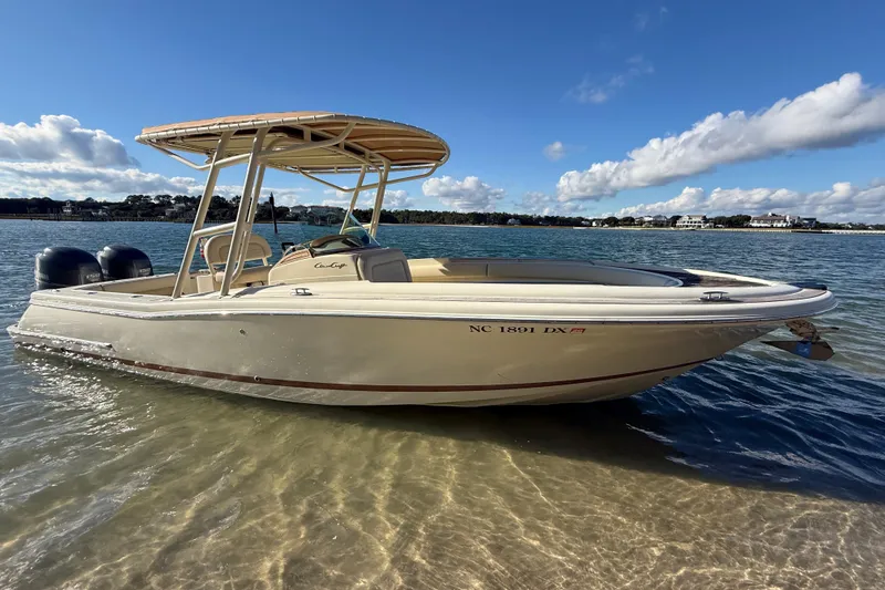 Slide: The Image of 2013 Chris-Craft Catalina 26 boat in shallow water, clear sky background. - 2