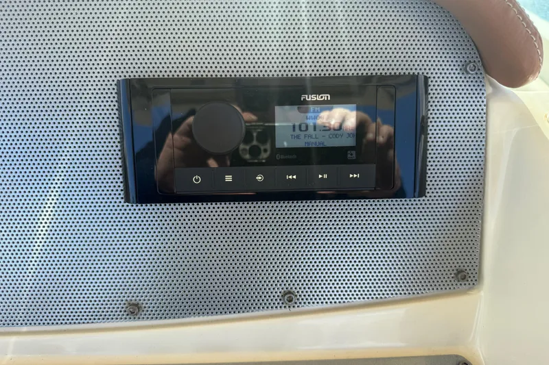 Slide: The Image of Fusion stereo system on 2013 Chris-Craft Catalina 26 boat dashboard. - 22