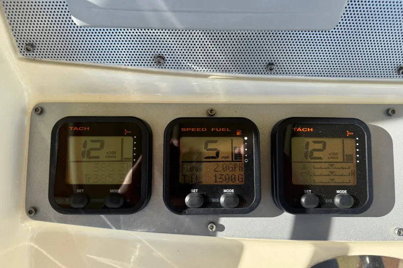 Slide: The Image of Dashboard of 2013 Chris-Craft Catalina 26 showing tachometer and speed fuel gauges. - 23