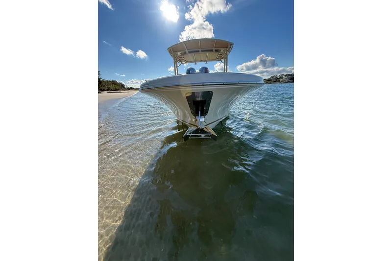 Slide: The Image of 2013 Chris-Craft Catalina 26 boat on clear water under a sunny sky. - 5