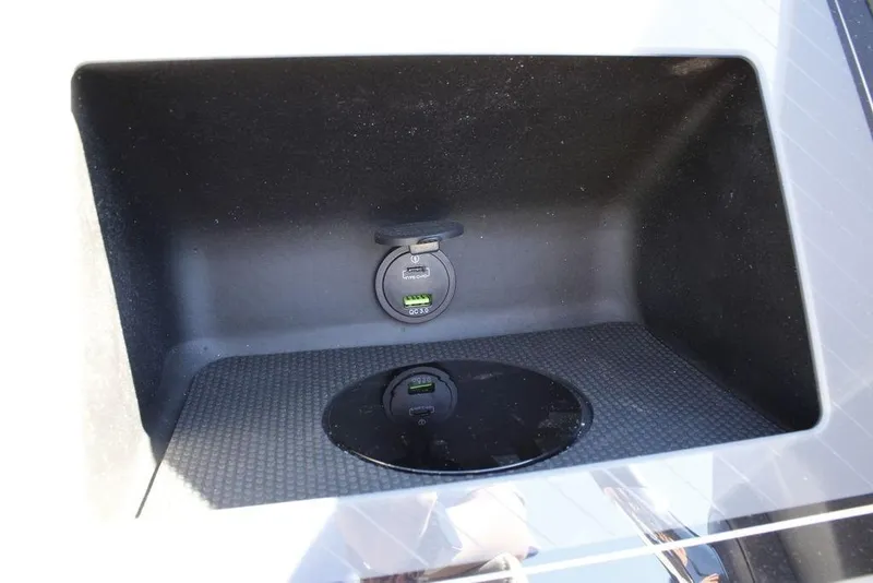 Slide: The Image of 2026 Avalon CATALINA 23 storage compartment with USB charging port. - 13